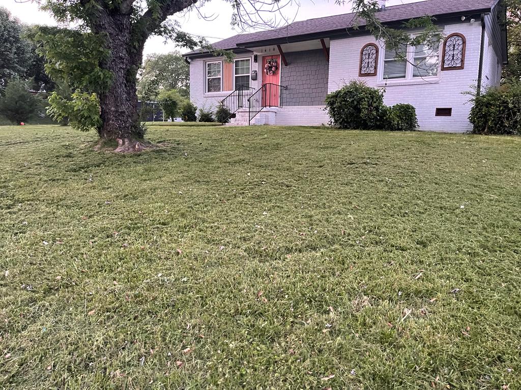 Brick house with freshly cut front lawn