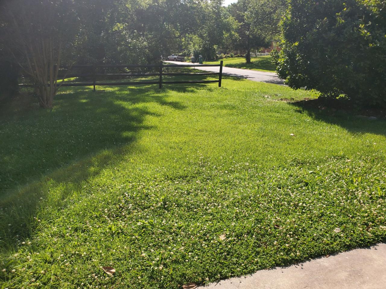 Country property with split-rail fence and manicured lawn